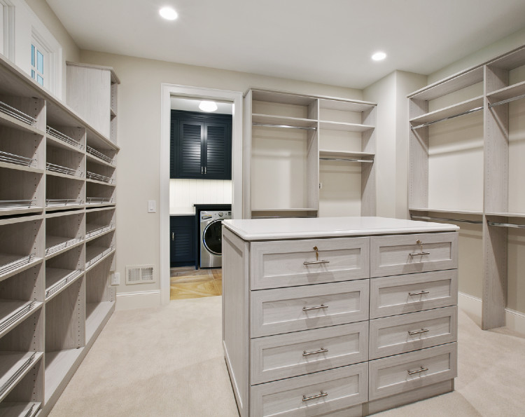 An empty closet with drawers and shelves