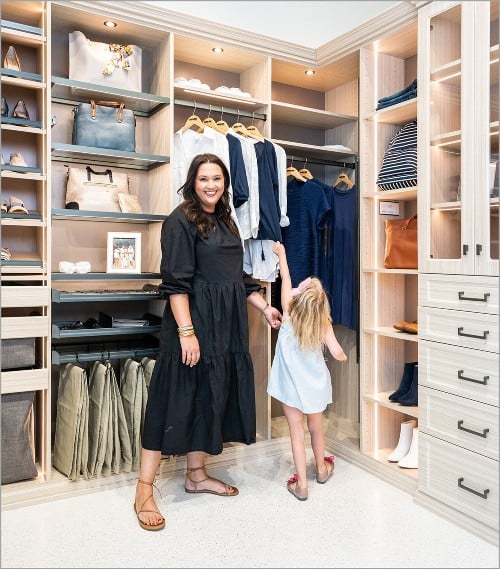 Floor to ceiling storage cabinets with hanging space and open shelves