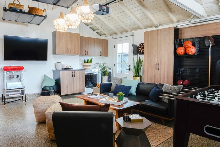 A garage with epoxy flooring and a design for a man cave