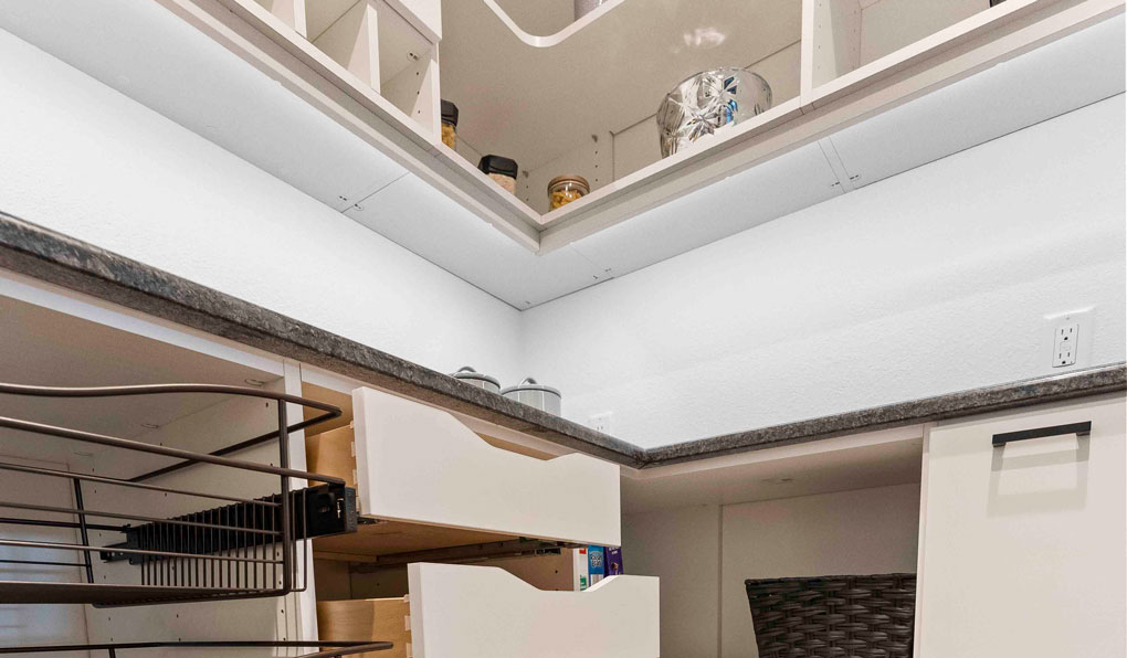 Custom pantry storage with shelves, drawers and baskets