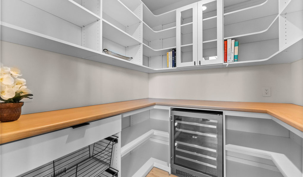 Pantry & laundry room closet organizers with custom shelving in Boston MA.